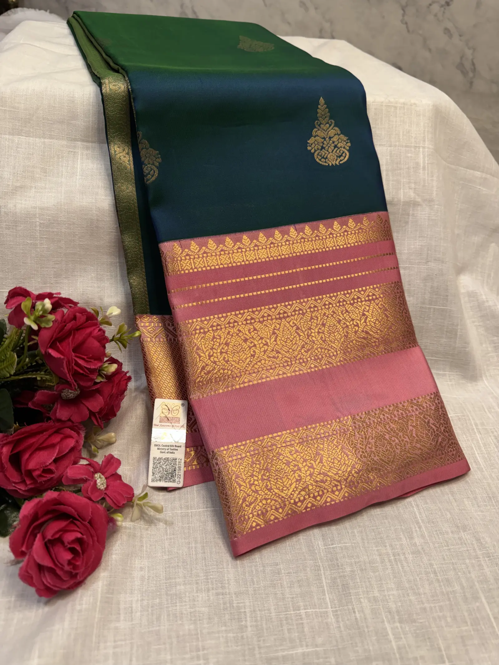 Elegant Pink and Teal Saree with Ornate Gold-Tone Border