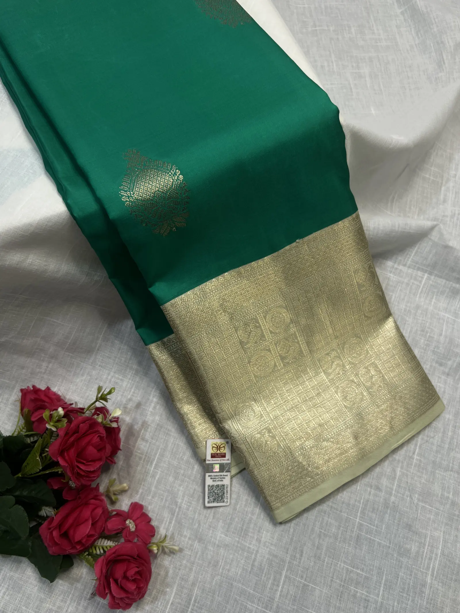 Emerald Green Saree with Gold Motifs and Pale Gold Border