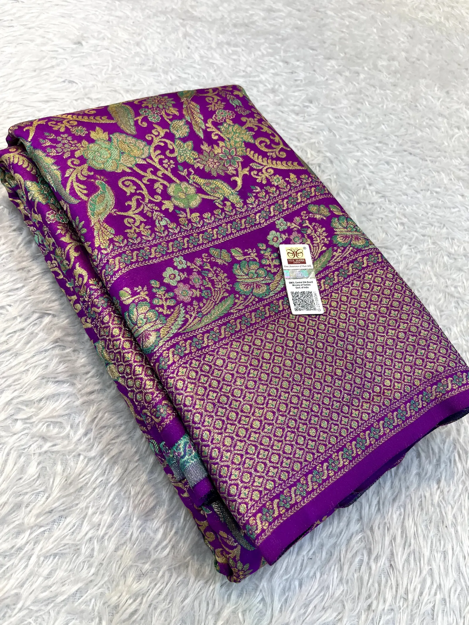 Purple Kanchipuram Silk Saree with Green Floral Border | E0873795