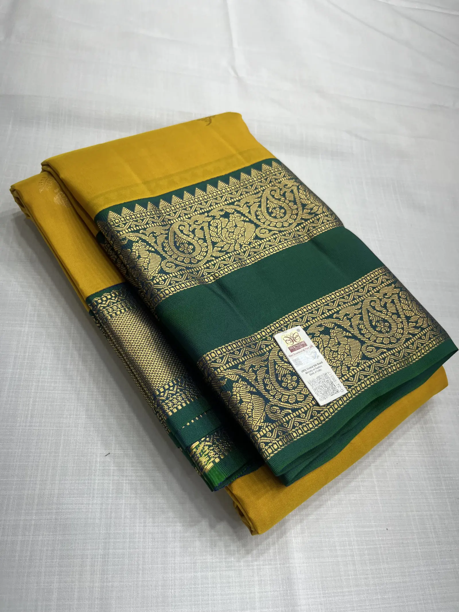 E0976013 – Mustard Kanchipuram Silk Saree with Green Zari Border