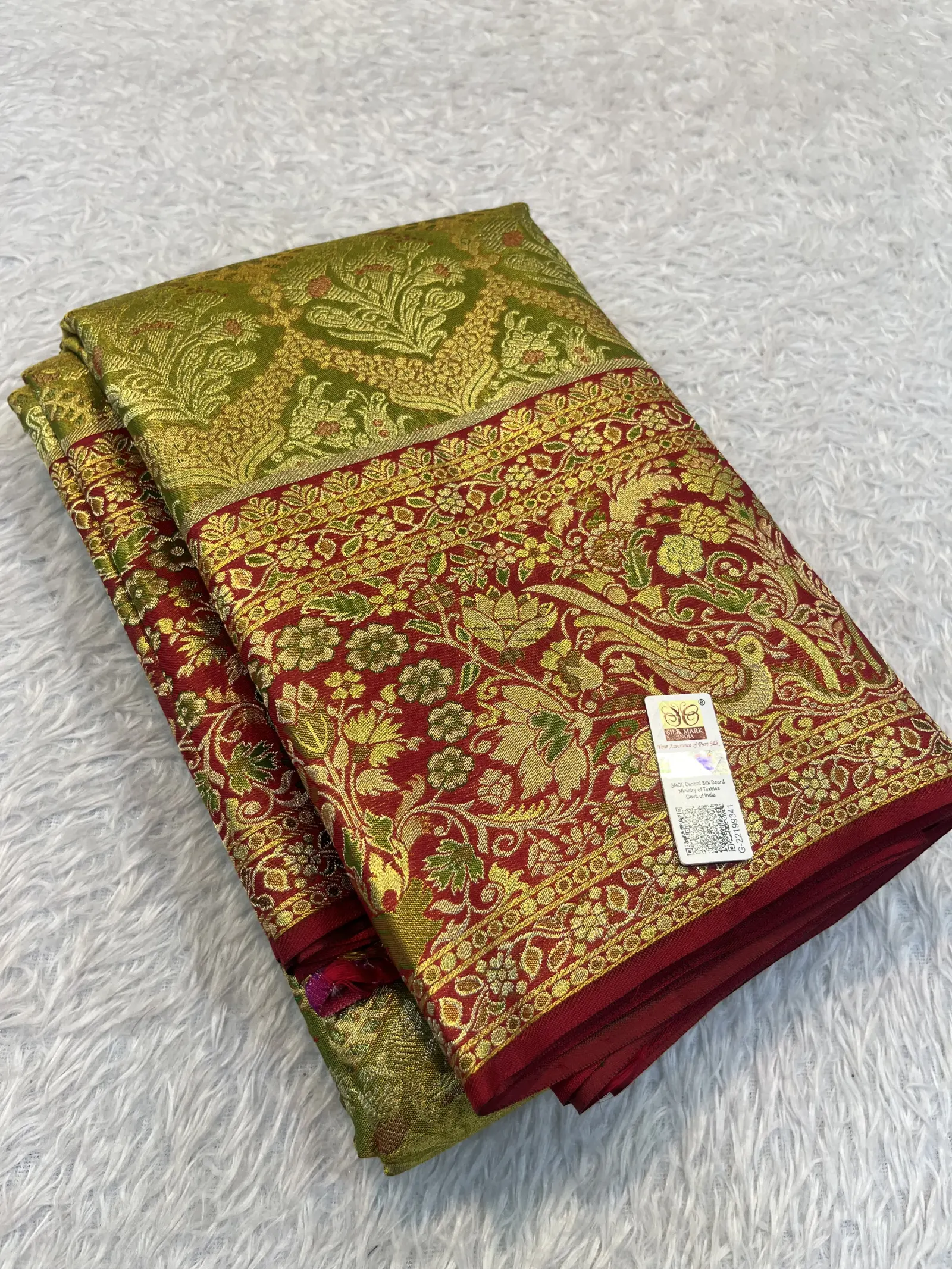 E1086216 – Olive Green Kanchipuram Tissue Saree with Maroon Border