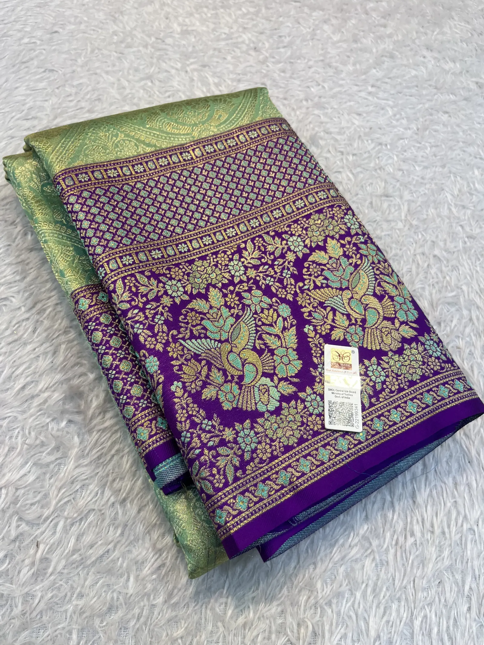 E1086077 – Pista Green Kanchipuram Tissue Saree with Peacock Border