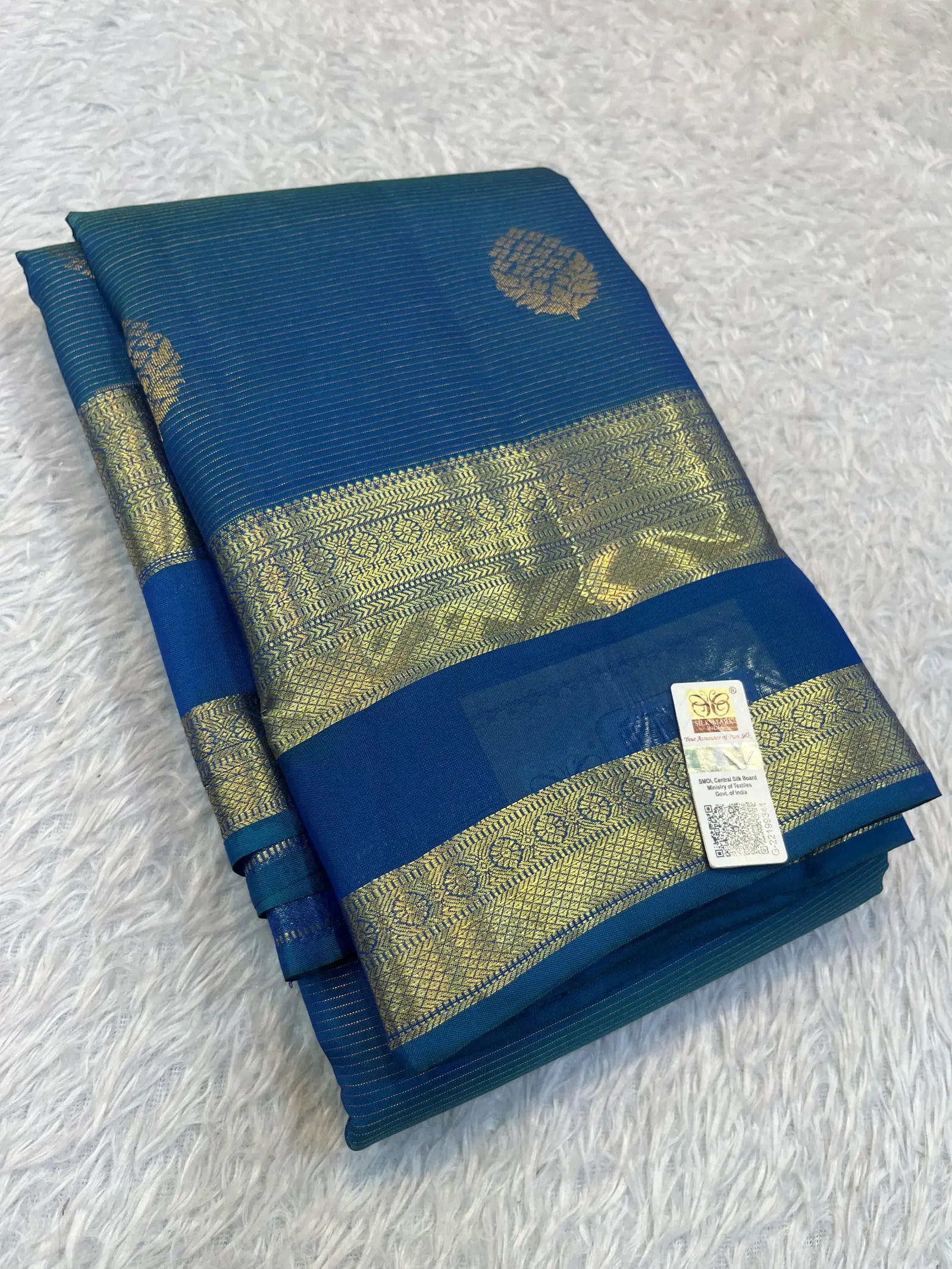 E1093546 – Peacock Blue Kanchipuram Silk Saree with Gold Buttas